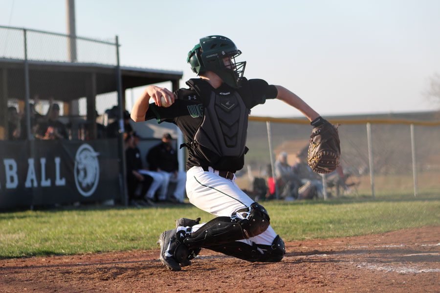 Sophomore catcher Trey Palmer throws back to the pitcher at the home game against Buffalo on March 26. The Cats won 11-8.