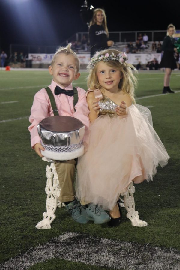 Bronx Boyer and Josie Parker participate in the Homecoming night by walking during half time and holding the crowns. Josie and Bronx were the “little royalty” and are both in preschool at Warsaw. 