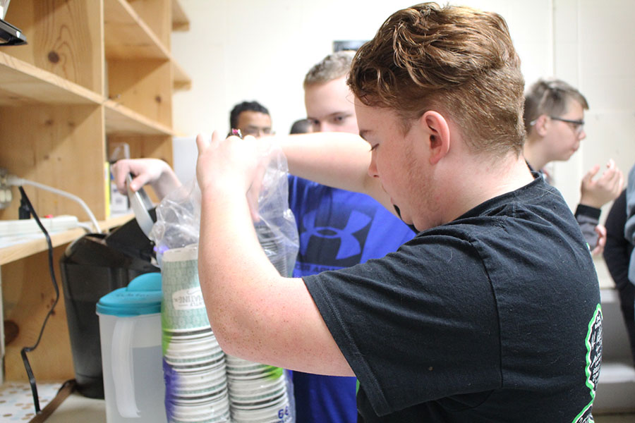 Senior Robert “Red” Harrison prepares the equipment needed to complete an order of coffee for a member of the Warsaw High School staff. Harrison is enrolled in mathematics teacher Bobbi Swisher’s seventh hour class and helps to prepare and serve drinks every Friday as a member of the Wildcat Café.