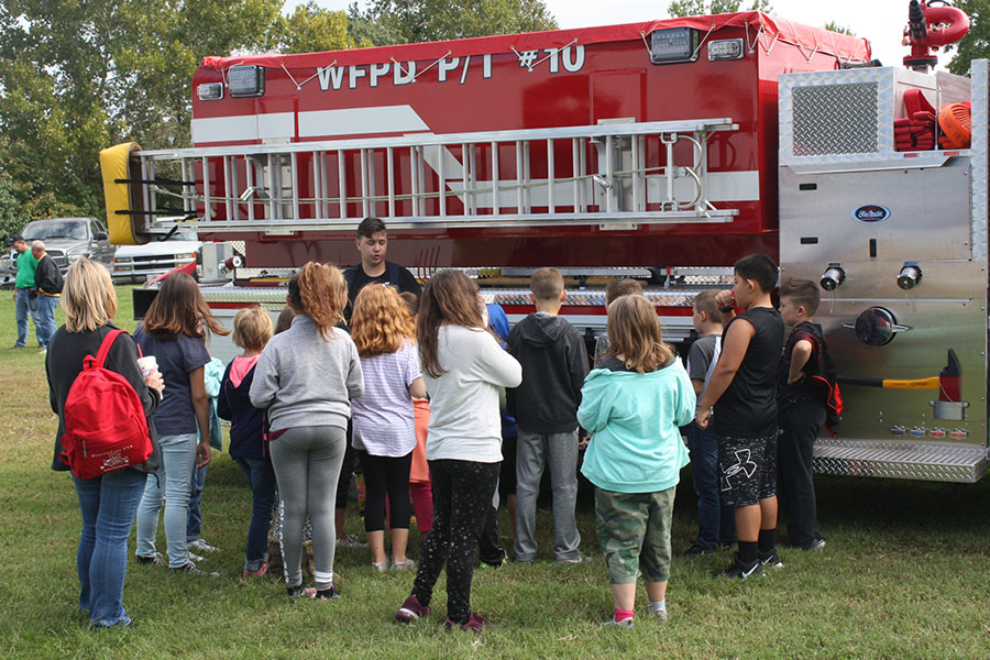 Senior Cody Lock talks to North School kids about fire safety. Lock is a volunteer fire fighter for Warsaw.