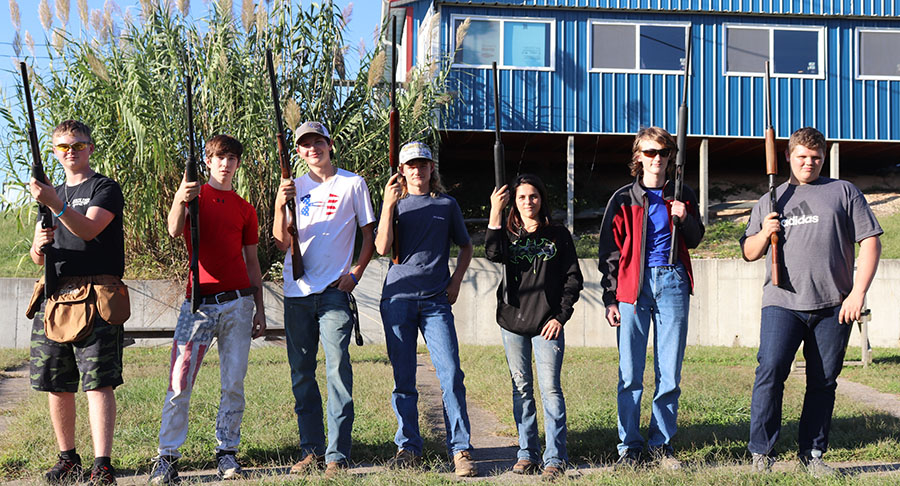 Warsaw FFA Trap members sophomores Dakota Steinhoff, Jonathan Hamiltion Parker Griego, freshman Tyler Bone, Emma MacWilliam, junior James Baumli and freshman Jacob Rains take a group picture after their practice on Oct. 8. Trap practice is held every Tuesday after school at the American Legion. 