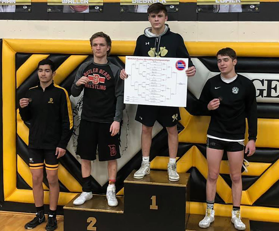 Senior Patrick Surrell celebrates his state qualifying performance at the district tournament on Friday, Feb 14. He took third place in his respective weight class (138).