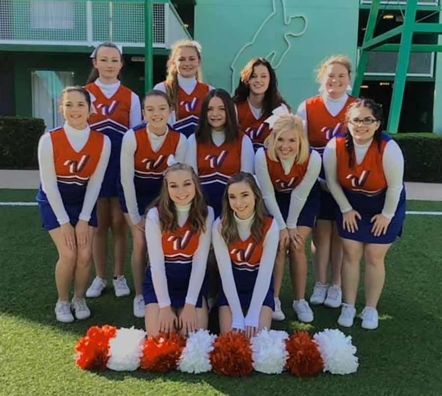 Cheerleaders+%28front%29+juniors+Darby+Mostaffa%2C+Hallie+Wenberg%2C+%28middle%29+freshman+Emma+MacWilliam%2C+sophomore+Natalie+Johnson%2C+junior+Haley+Dwyer%2C+seniors+Andrea+Merritt%2C+Aubrianna+Umlauf%2C+%28back%29+junior+Ariel+Givens%2C+sophomore+Jolina+Givens%2C+juniors+Cassidy+Parks+and+Jamie+Jorgensen+gather+together+for+a+picture+in+their+All-American+Cheerleader+uniforms.+The+Warsaw+Cheer+squad+was+given+the+opportunity+to+perform+in+Orlando+during+the+pregame+show+of+the+Citrus+Bowl+on+Jan.+1.+