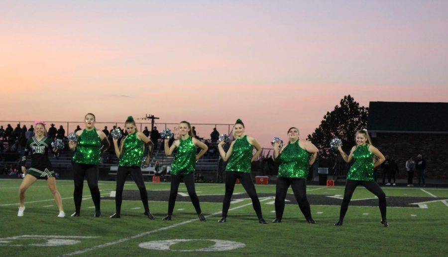 The Emerald Stars (juniors Kaylee Lawson, Brea Jolliff and Jolina Givens, seniors Ariel Givens, Lauren Kreisel and Sabrina Uptgraft and sophomore Lilia Jensen) dance at the Oct. 16 Homecoming game during the pregame show.  The dance team also performed on the sideline during the game.