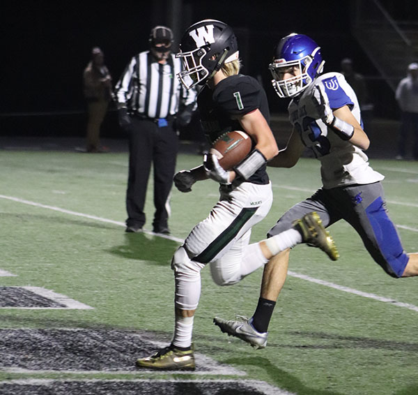 Senior wide receiver Zach Sharp runs the football in for a Wildcat touchdown. Warsaw advanced to the second round of district ply defeating Lone Jack, 42-7.