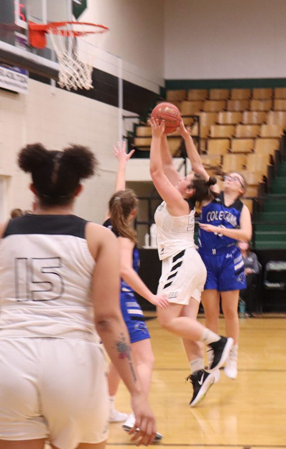 Sophomore Ellie Murrell drives into the paint to score against Cole Camp. Warsaw beat Cole camp to 57-35 in the Warsaw tournament.





 