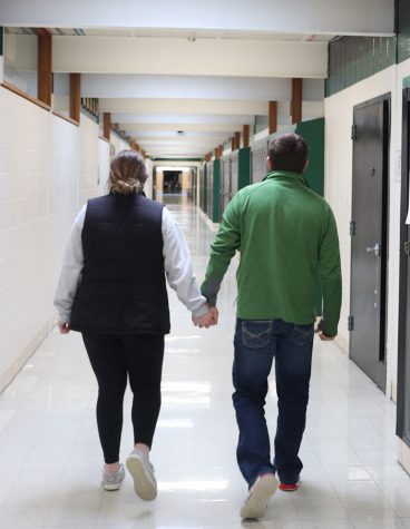Right: Sophomore Gracie Comer and junior Cameron Taylor hold hands as they walk the halls. Comer and Taylor have been dating for one year and four months. 