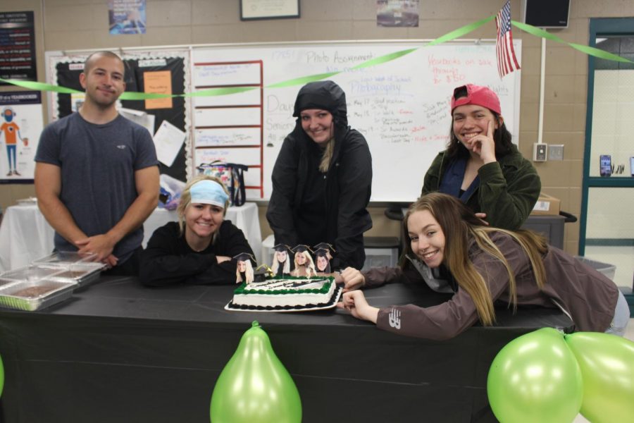 On the left Newspaper staff writer, Joe Montez, Newspaper editor an chief, Rheanna Coke, Yearbook editor an chief, Brooke Spry, Newspaper editor an chief, Emmaleigh Kowal, and  Newspaper design editor, Darby Mostaffa celebrating their graduation party before they leave.