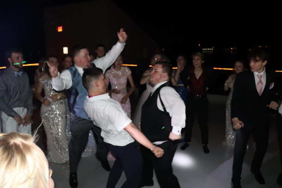 Senior Grant Miller and guest Aidan Lemmons dance on the rooftop of The Lodge of Four Seasons. One of the dance highlights was Miller doing the worm. 