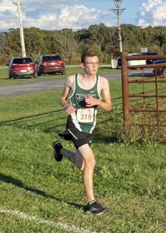 Junior Logan Schockmann races at Camdenton. Schockmann posted one of his fastest times at the Oct. 7 Buffalo meet with 18:53.54