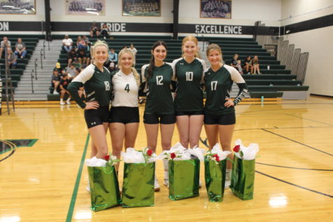 Volleyball seniors Emma Johnson, Taylor Howe, Taylar Kleihauer, Karlie Jones, and Bella Morrison come together for a picture before their senior night game against the Osecola Indians on Sept. 6. Volleyball seniors were recognized for all of their hard work before the varsity game.