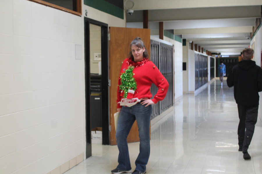 Math teacher Bobbi Swisher shows off one of her many hand made Christmas sweaters. Swisher has an extensive collection of ugly Christmas sweaters.