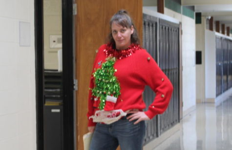 Math teacher Bobbi Swisher shows off one of her many hand made Christmas sweaters. Swisher has an extensive collection of ugly Christmas sweaters.