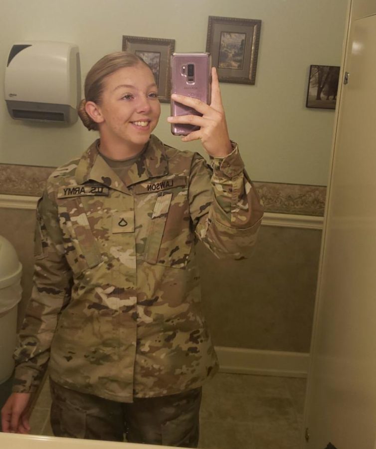 Senior KayLee Lawson takes a picture in her uniform to share with family and friends. Lawson attended boot camp for National guard last summer. 