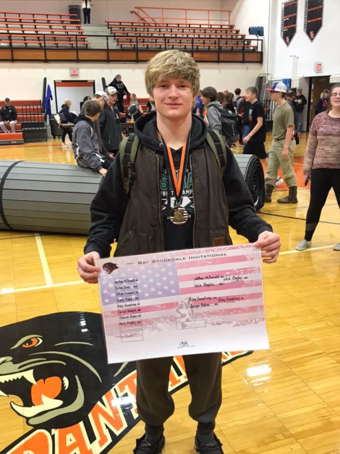 Junior+Nick+Bagley+celebrates+his+first-place+win+at+the+Ray-Stockdale+Invitational+on+Dec.+4.+Bagley+got+the+takedown+in+overtime.