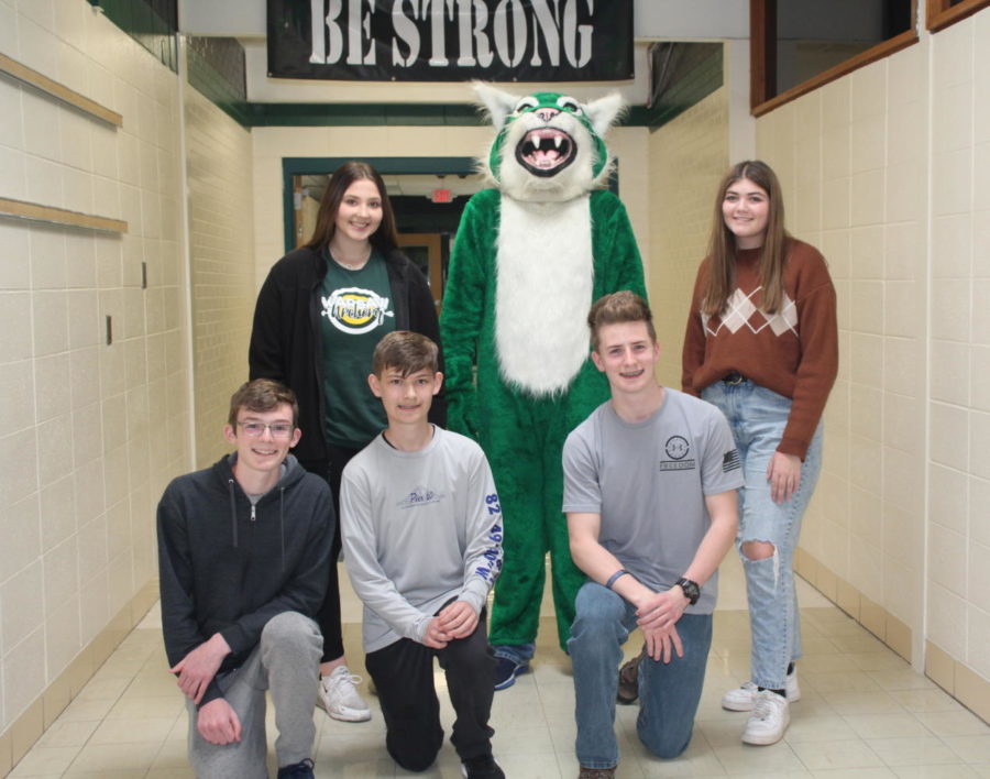 State archery qualifiers celebrate with Wally the Wildcat after their state walk and before heading to Branson for the state tournament. They included: (front row) junior Logan Schockmann, middle schooler Levi Bilderback, junior Hudson Karr; (back row) juniors Ellie Murrell and Anna Siegel.