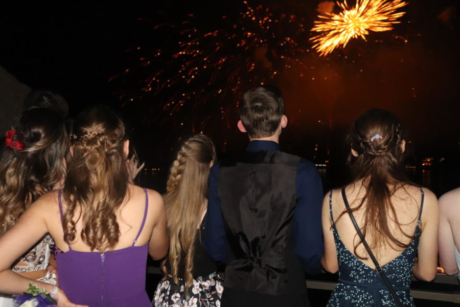 Junior+Logan+Schockmann+and+senior+Alyssa+Alcantara+watch+the+firework+display+accross+the+lake+at+the+2021+prom.+Last+year%E2%80%99s+prom+was+held+on+the+rooftop+of+the+Lodge+of+the+Four+Seasons+a+the+Lake+of+the+Ozarks.+The+2022+prom+location+has+not+yet+been+announced%2C+but+will+be+held+May+7.