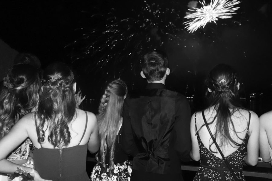 Junior Logan Schockmann and senior Alyssa Alcantara watch the firework display accross the lake at the 2021 prom. Last year’s prom was held on the rooftop of the Lodge of the Four Seasons a the Lake of the Ozarks. The 2022 prom location has not yet been announced, but will be held May 7.