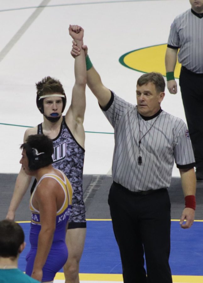 Junior Hudson Karr wins his first wrestle back round by points (9-4) at state.