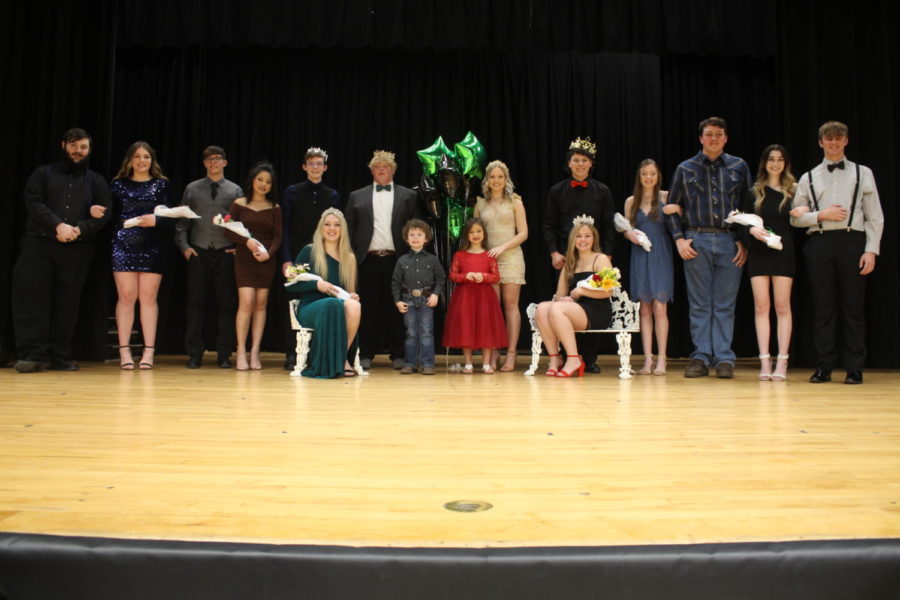 The Courtwarming court celebrates coronation in between games against El Dorado Springs on Feb. 10. The court was made up of junior candidates Jesse Parker, Gracie Comer, Cameron Seevers, Abigail Dendish, prince Logan Schockmann, and princess Ashlyn Laue, returning king Logan Strunk and returning queen Aspen Whitaker, crown bearers Brady Spry, and Avery Ferguson, king Gaven Cunningham, queen Nora McMillin, senior candidates Natalie Johnson, Alan Landsberg, Madison Coskey, and Brayden Elmer.