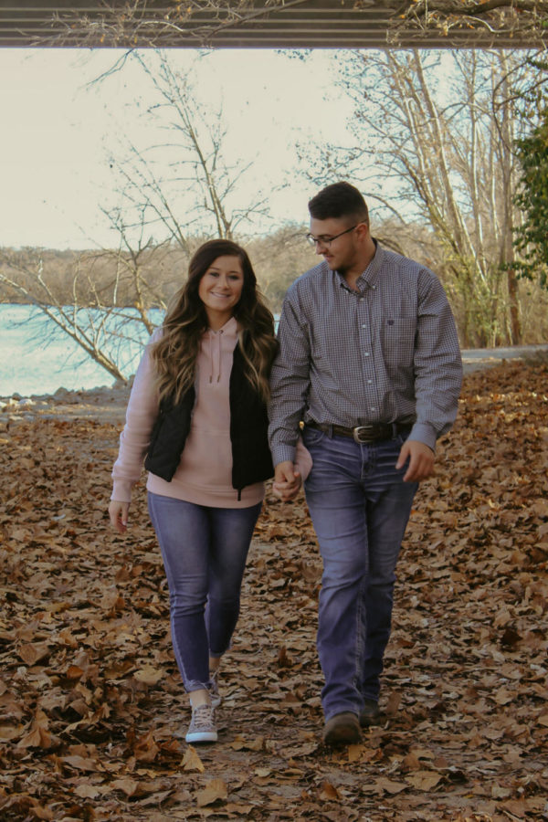 2021+Graduate+Kylee+Fajen+walks+with+fiance+Anthony+Lawerence.+They+are+planning+a+wedding+in+August.+