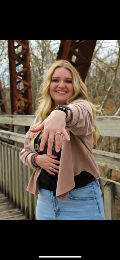 2021 Graduate Brooke Spry shows off her engagement ring. She and her fiance, Aidan Comer, plan to get married in Aug. 2023. 