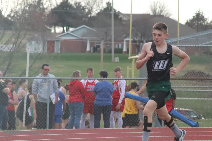 Freshman Jaxson Deckard competes in the 3200 meter race at Stockton on April 5. He placed sixth with a time of 12:25.15.