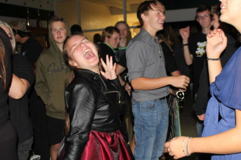 Senior Lilia Jensen busts a move at the Homecoming dance. The dance was canceled in 2020 and held outside on the football field in 2021. This was the first year the dance was back in the high school cafeteria. 