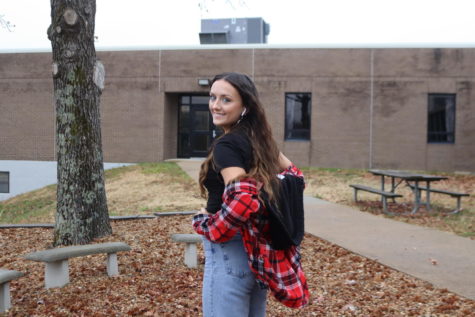 Sophomore Tatum Bohl shows off her flannel shirt. She said flannel is her fashionable choice for cold weather.