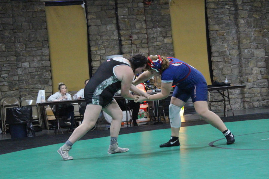 Sophomore Brooklyn Jackman makes contact with her California opponent in the Warsaw dual on Dec. 8. Jackman won the match.