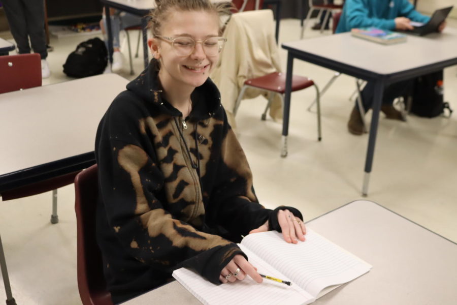 Junior Jax Todd works at her desk while working on a writing assignment.