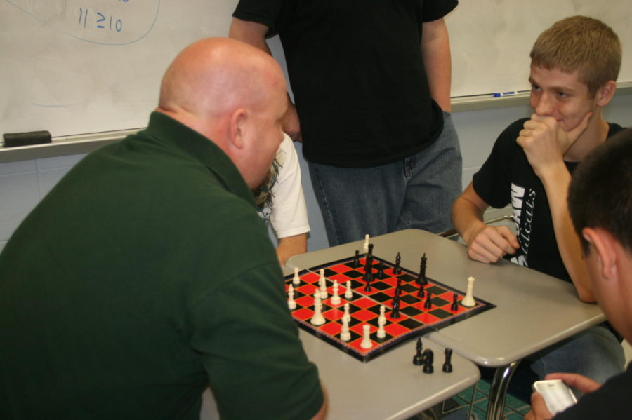 2011 Junior Coyan Bidwell contemplates his next move against his opponent, 2011 math teacher and current Superintendent Scott Gemes. Chess club was one of the special activity groups offered to students once a week. Other groups included photography, embroidery, “American Idol” contest and many more.