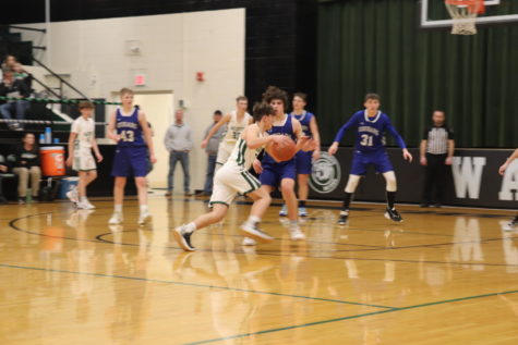 Sophomore Garrett Ferguson drives to the basket against the Climax Springs Cougars on Jan. 30. The Wildcats fell to the Cougars 51-57. 