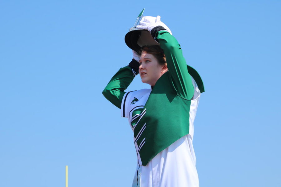 Junior Alyson Alcantara prepares to direct at a fall marching competition. Alcantara was one of two drum majors.