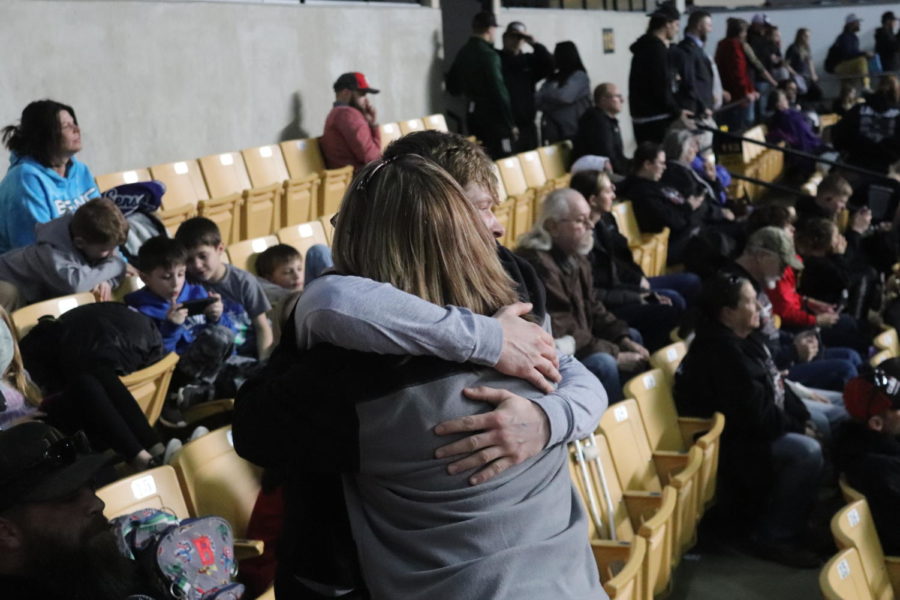 Senior Nick Bagley hugs his mother, Heather, after wining his third-place state match. Bagley won the match by points. 