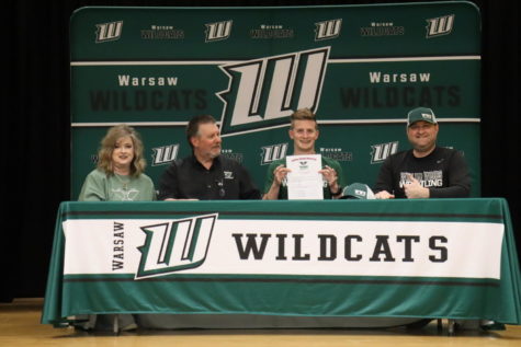 Senior wrestler Hudson Karr signs with William Woods University. William Woods is a NAIA private school