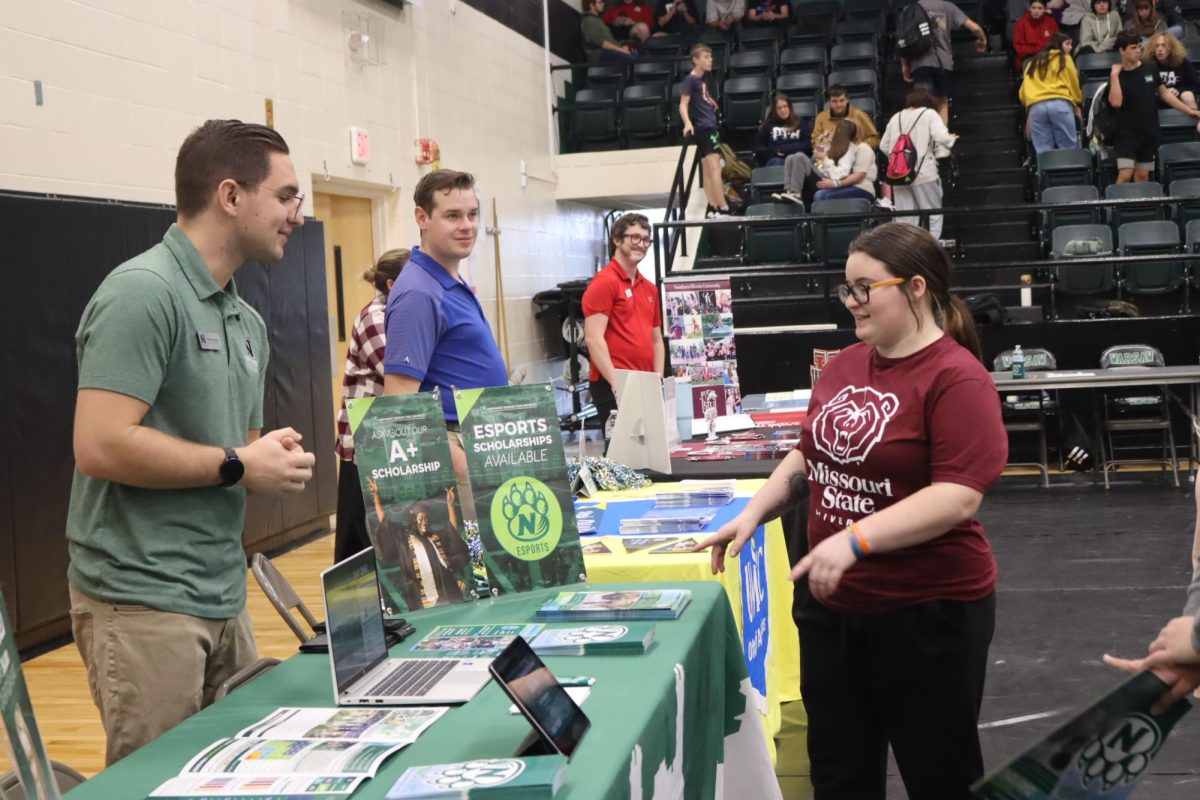 Senior Lovlie Haidusek learns more about Northwest Missouri State University at Benton County College Fair on October 19th.