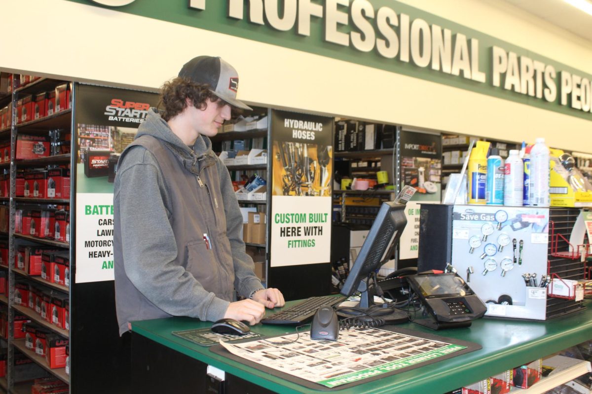 Senior Bryson Gollihar searches for a car part on the computer. Gollihar has been working at O’Reilly Auto Parts for a year now. 