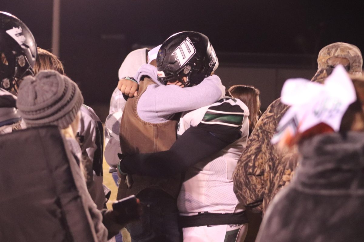 Senior+offensive+lineman+Devon+Boul+hugs+his+cousin+Gage+Whitaker+after+a+tough+loss+in+the+district+championship+game+against+the+Father+Tolton+Trailblazers.+%E2%80%9CIt+was+the+worst+day+of+my+life+because+it+was+the+last+time+I+would+touch+a+football+field+with+pads+on%2C%E2%80%9D+he+said.