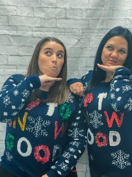 Ashley Reimund and Jackie Whitaker match sweaters and get excited for Christmas. 