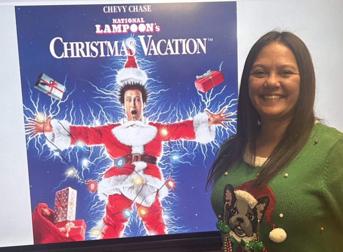 Special education teacher Jackie Whitaker shows of her favorite Christmas movie Christmas Vacation. She likes this movie because it take her back to when she was younger.