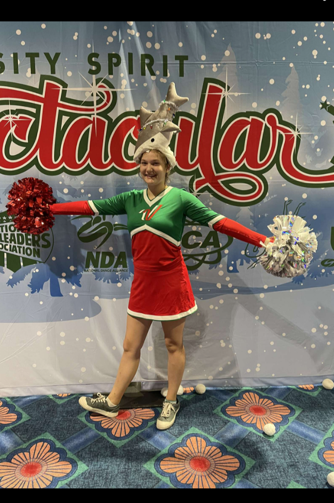 Chloey Brazel in the middle of preparing before the All American Cheer parade on Nov 18. 