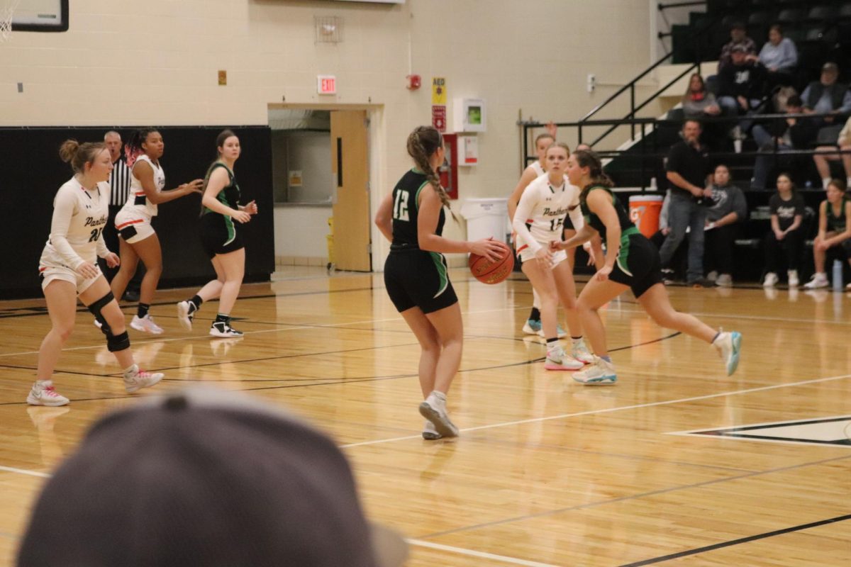 Sophomore guard Tanna Howe reverses the court and is looking to pass the ball to her teammate in the corner. The Lady Cats fell short 39-55 in their first game of the Warsaw Tournament.