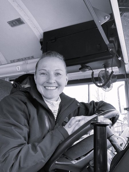Bus Z driver, Sara Gollihar greets students before her route. Gollihar is in her second year of driving at Warsaw. 