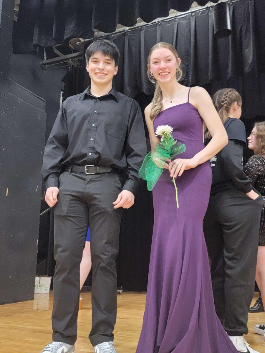 Senior candidates Grace Drake and Zane Huffman stand on stage for a picture after the ceremony. “It was fun getting to be a candidate and I was honored to be apart of the court,” said Drake.
