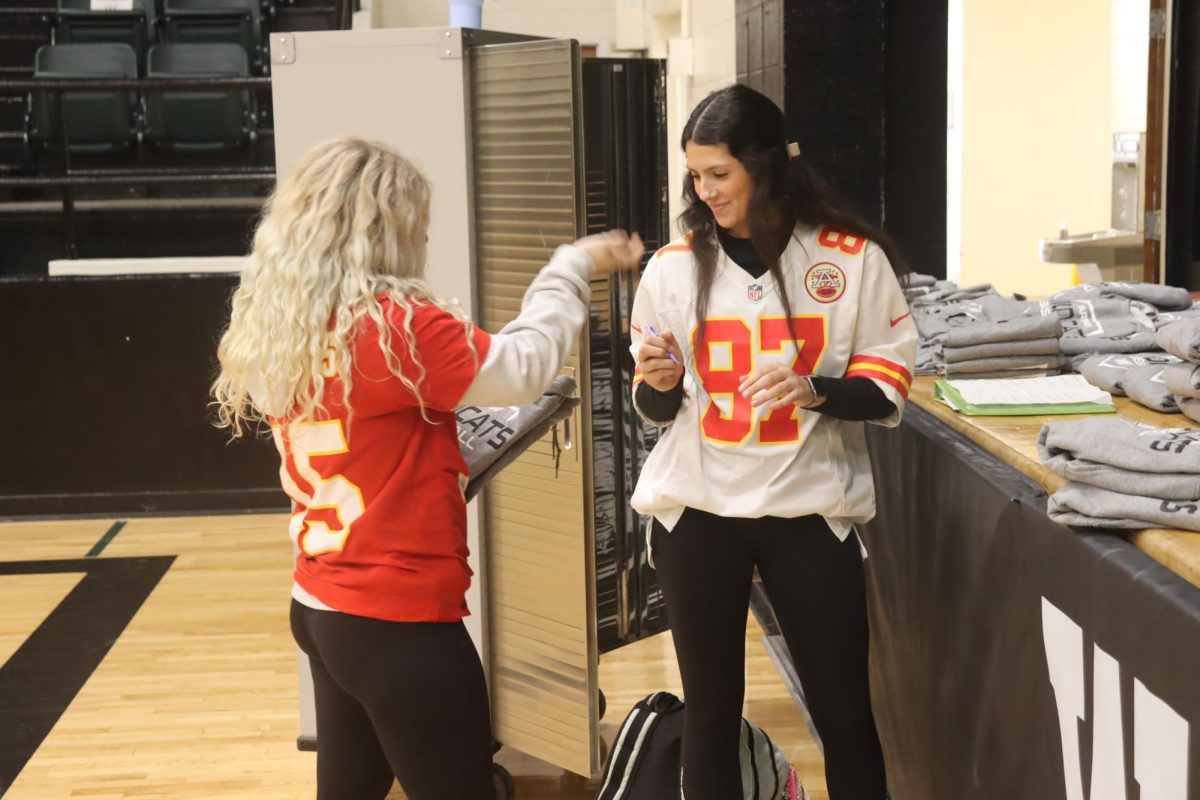 Sophmores Kaleby Stevenson and Hailey Ferguson help Boosterclub while still supporting the Chiefs. No matter what I am doing, I am always supporting the Chiefs, said Ferguson.