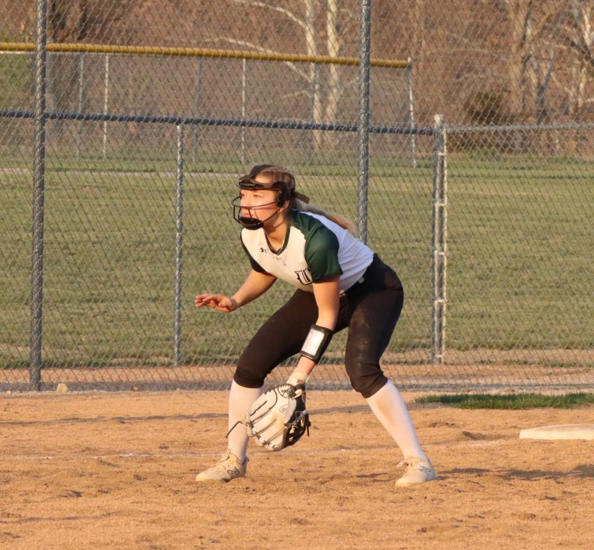 Freshman Madyson Reimund takes infield as a third baseman for the Lady Cats versus Lone Jack.
