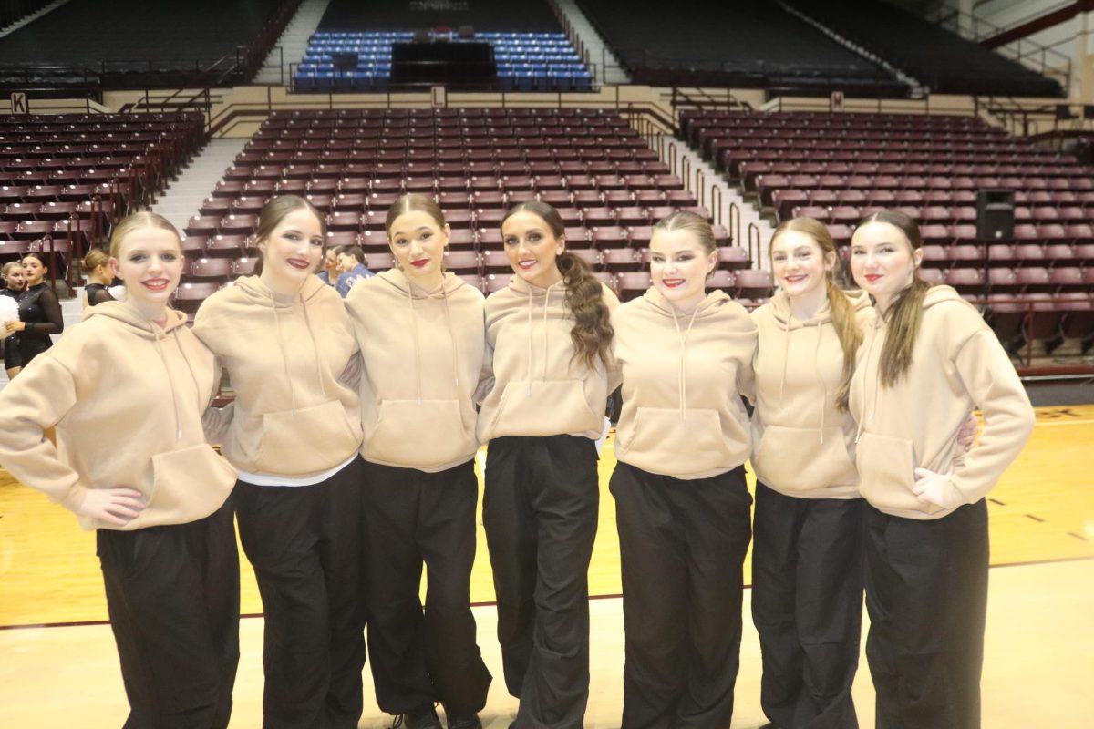 Left: Emerald Stars dancers, freshmen Lily Frye, junior Madison Lawrence, sophomore Shaelynn Ward, junior Tatum Bohl, junior Hazel Thompson and freshmen Izzy Schierholz and Bella Schwartz, prepare for their hip hop competition routine. They competed at both Missouri State University and the state competition in Kansas City