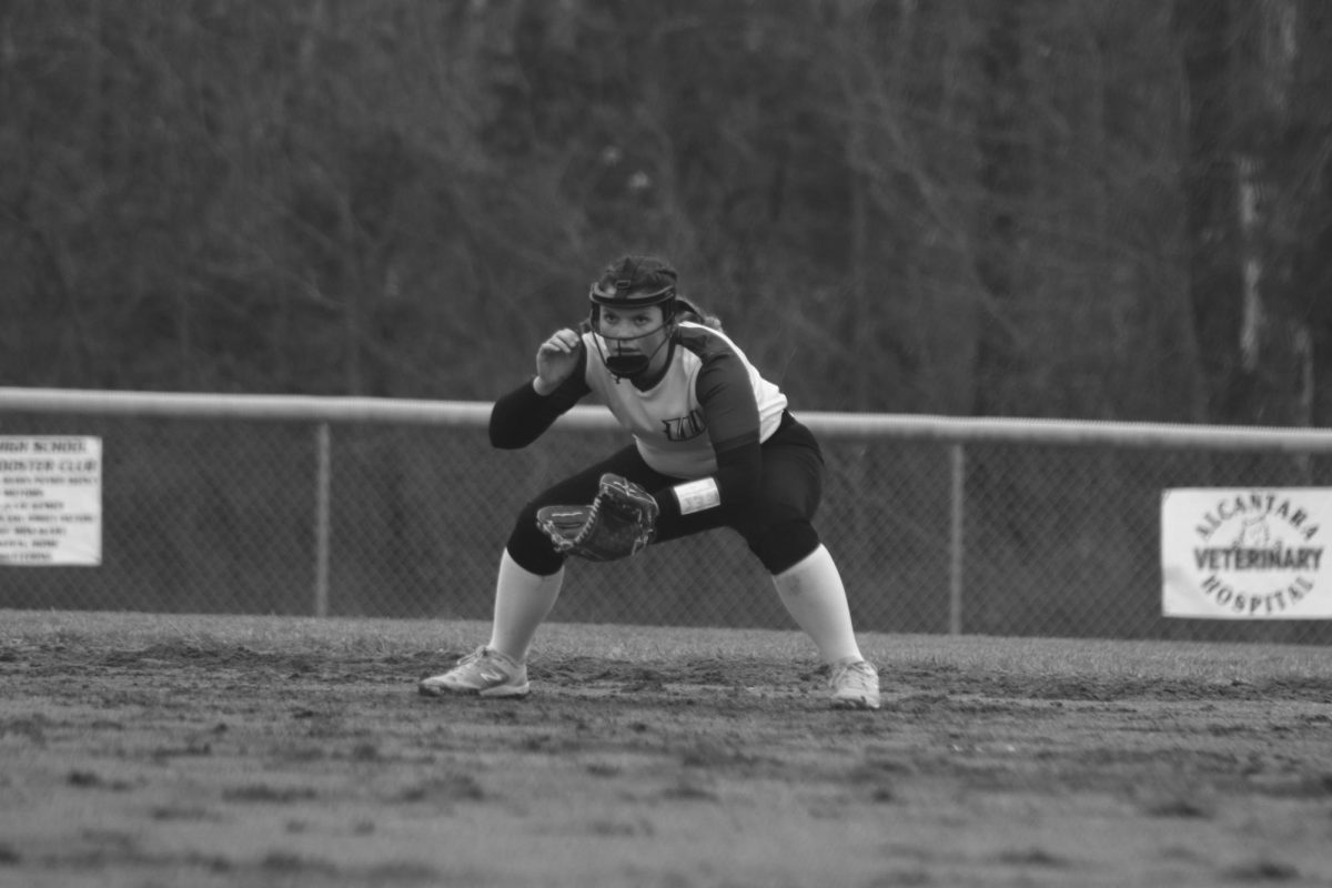 Senior second baseman Olivia Strange breaks down into position to field a ground ball. The Lady Cats walked away victorious against the Green Ridge Tigers early in the season. 