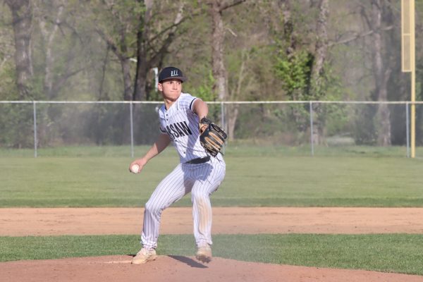 Junior pitcher Garrett Ferguson pitches the ball from the windup motion. Ferguson was the number two pitcher on varsity this season. 